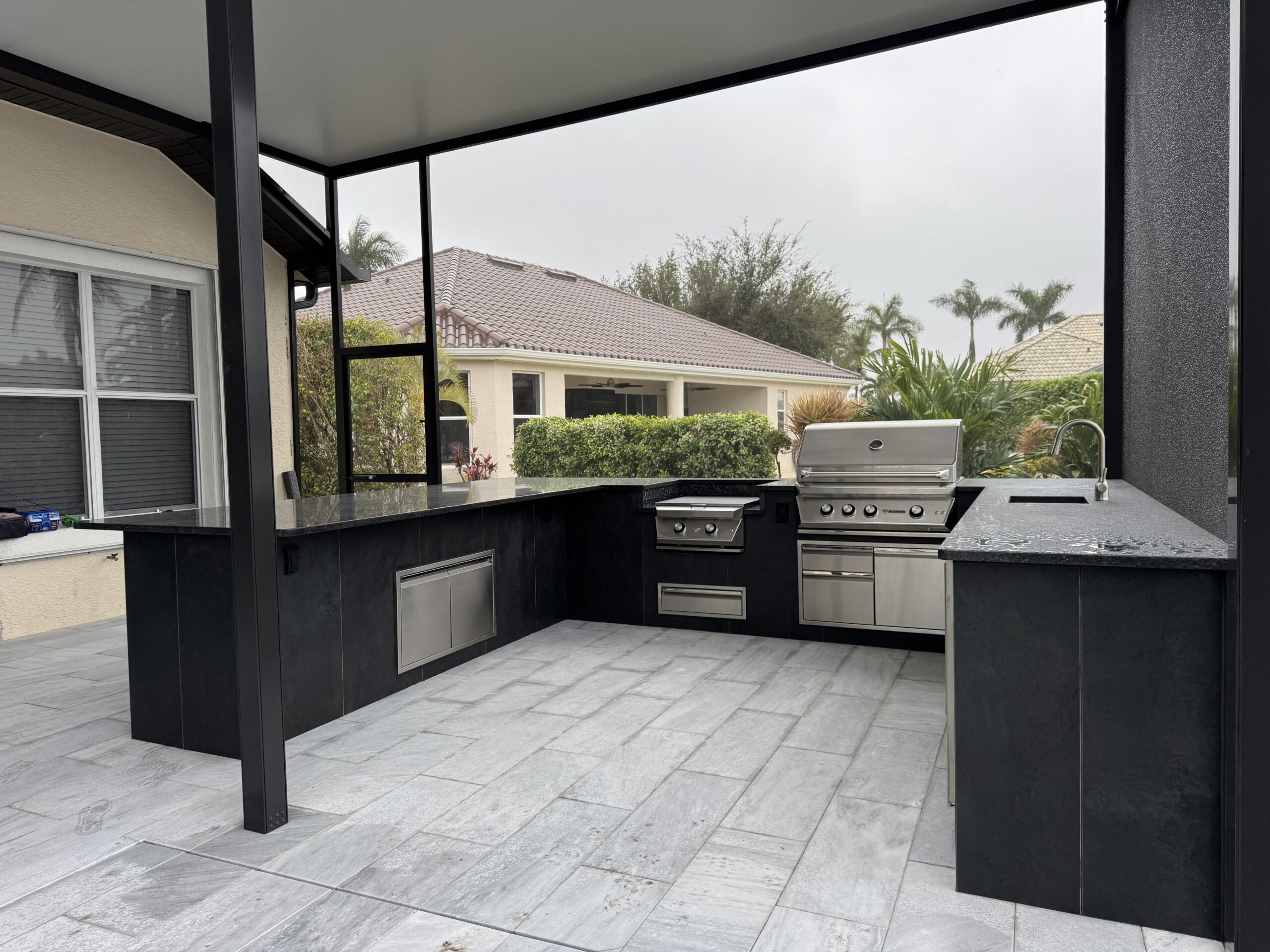 Covered outdoor kitchen from The Valor Construction website.